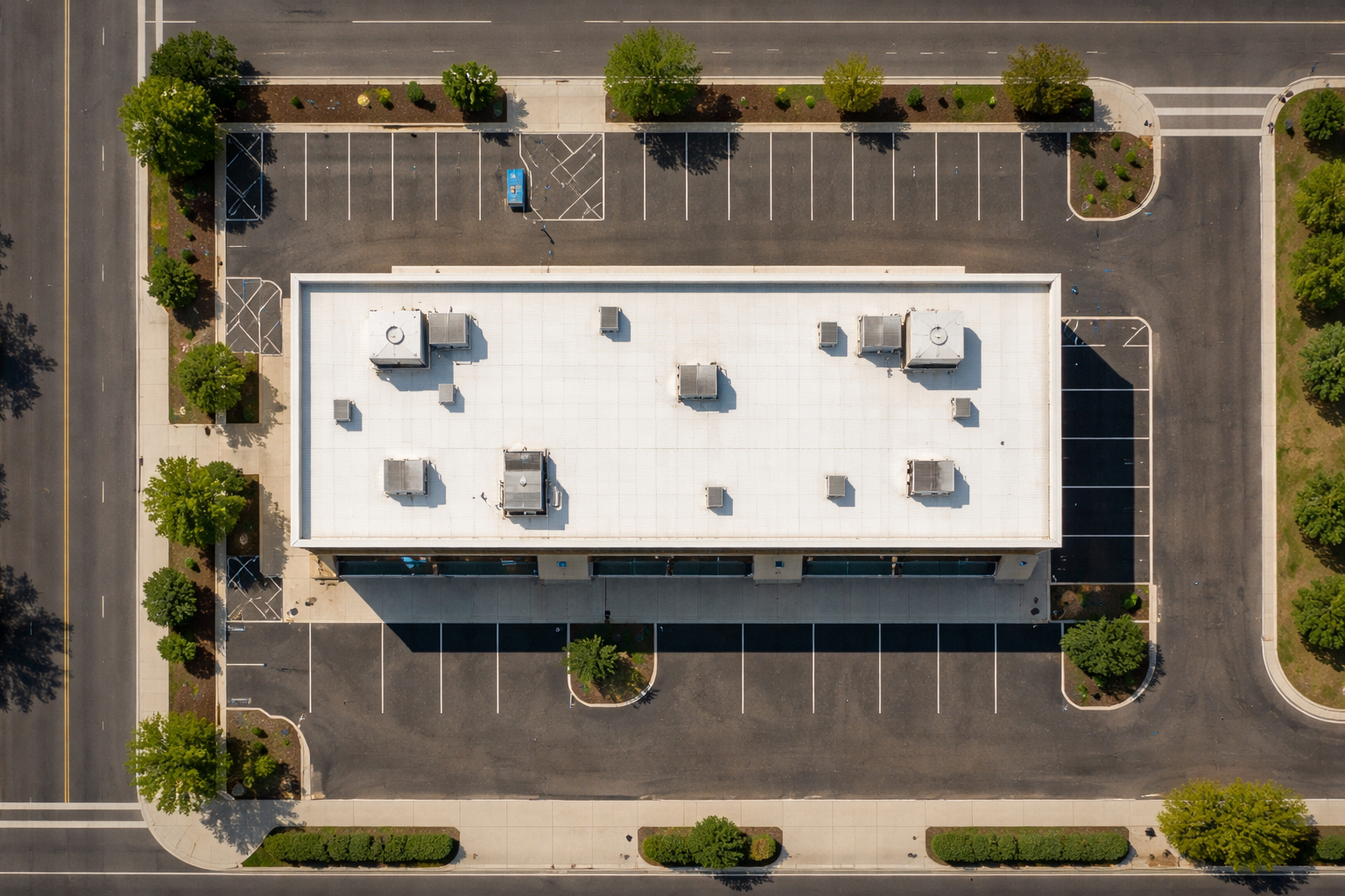 Rose Rock Roofing completed commercial flat roofing system with rooftop equipment