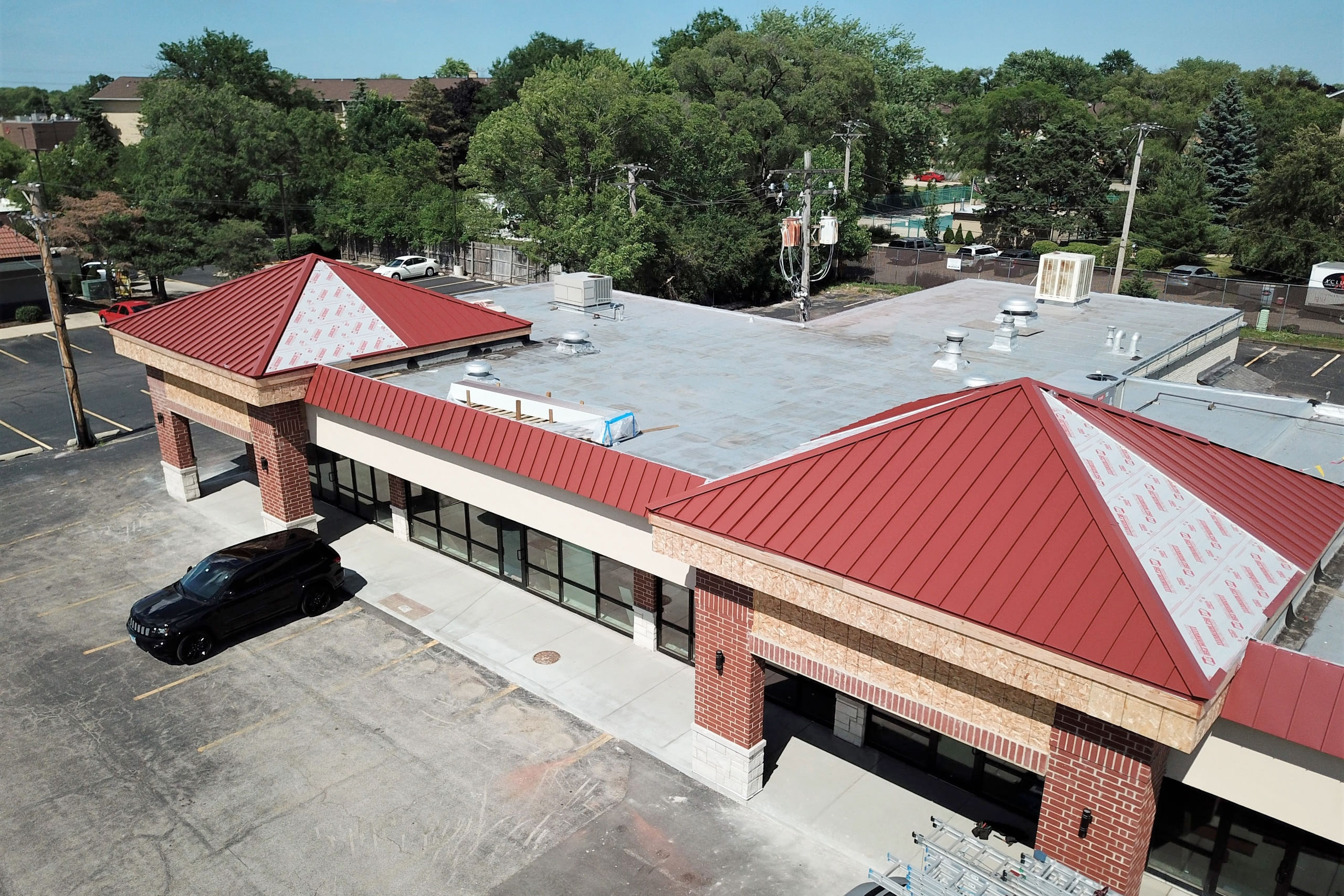 Rose Rock Roofing commercial metal roofing installation top view on small structure